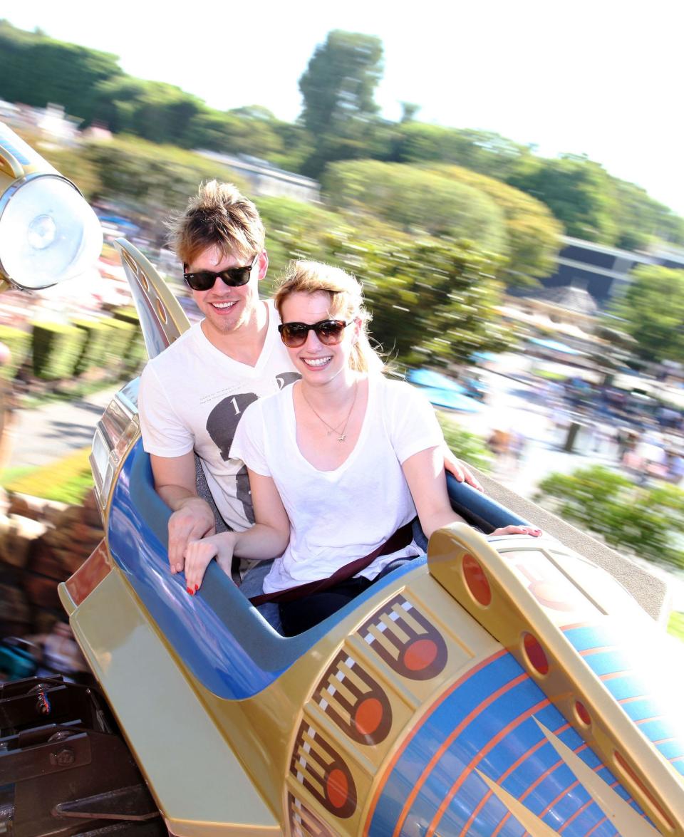 Chord Overstreet and Emma Roberts ride the Astro Orbitor at Disneyland.