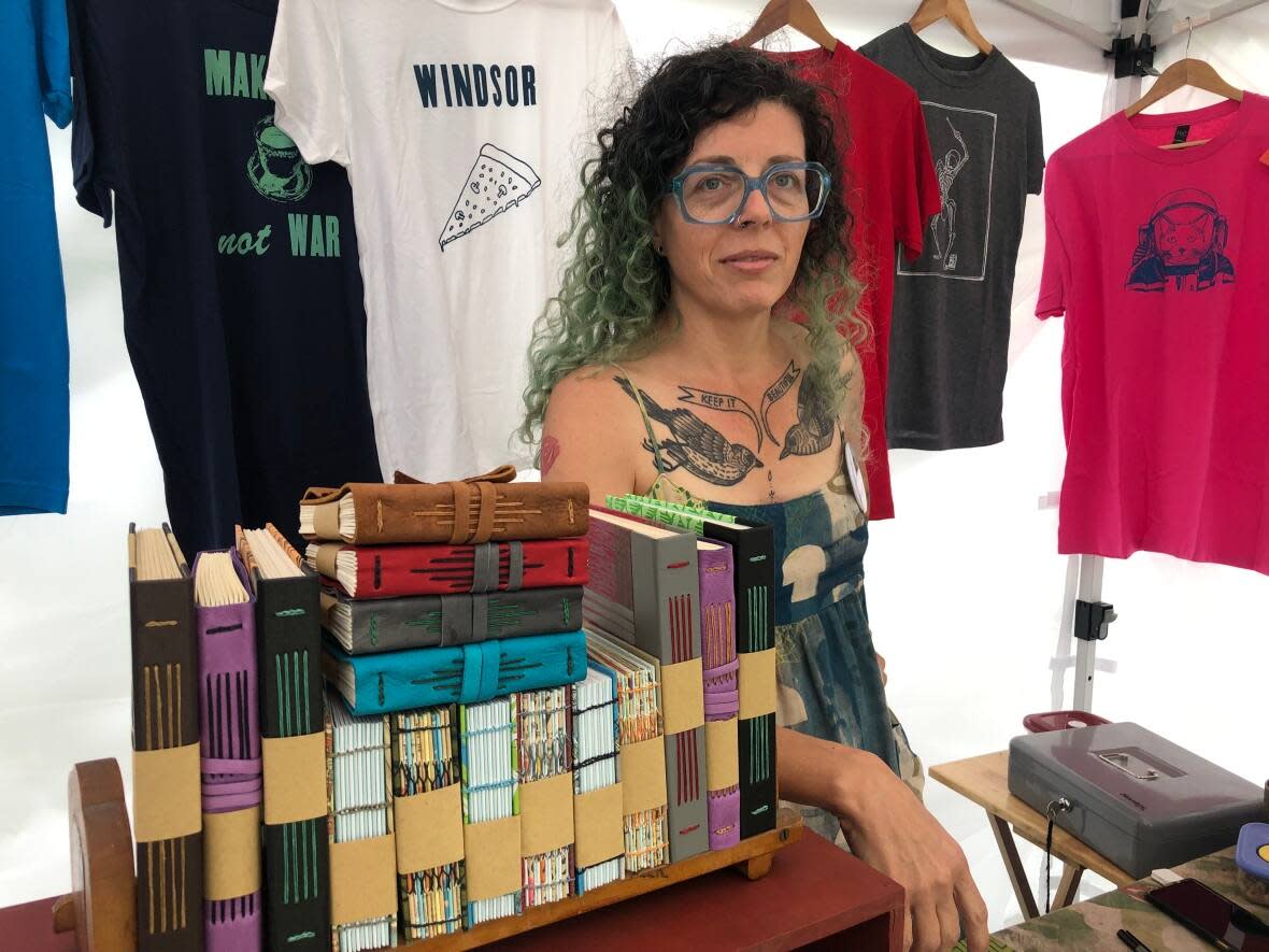 Jodi Green, owner of Levigator Press, says Art in the Park is her first showing since the pandemic began and that business went quite well at the event. (Jacob Barker/CBC - image credit)