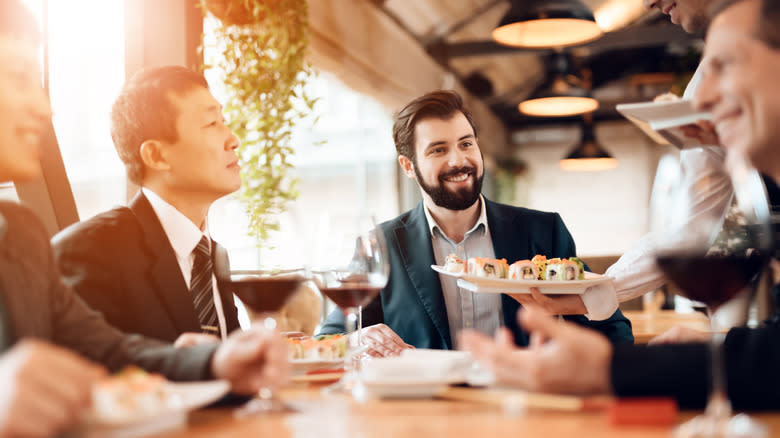 sushi bring brought to table in restaurant