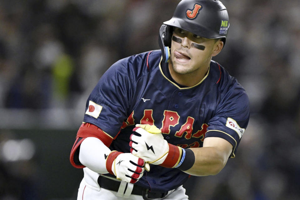 Japan team's Lars Nootbaar gestures during a Pool B game against Australia on March 12, 2023, at Tokyo Dome in Tokyo. Nootbaar's pepper-grinder gesture is catching on all across Japan, not just at the Tokyo Dome.(Kyodo News via AP)