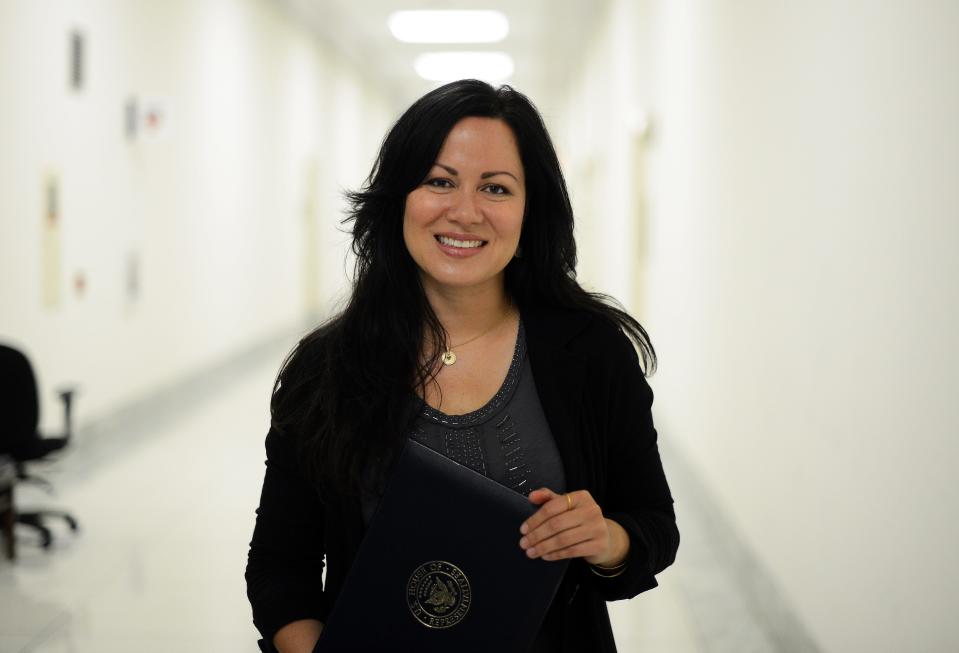 Shannon Lee, daughter of late Bruce Lee, poses at the Rayburn House Office Building on Capitol Hill in Washington, DC, on May 17, 2012.