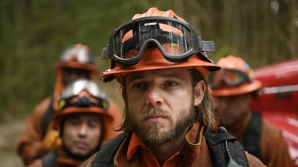 Max Thieriot as Bode Leone in firefighting gear in Fire Country season 2