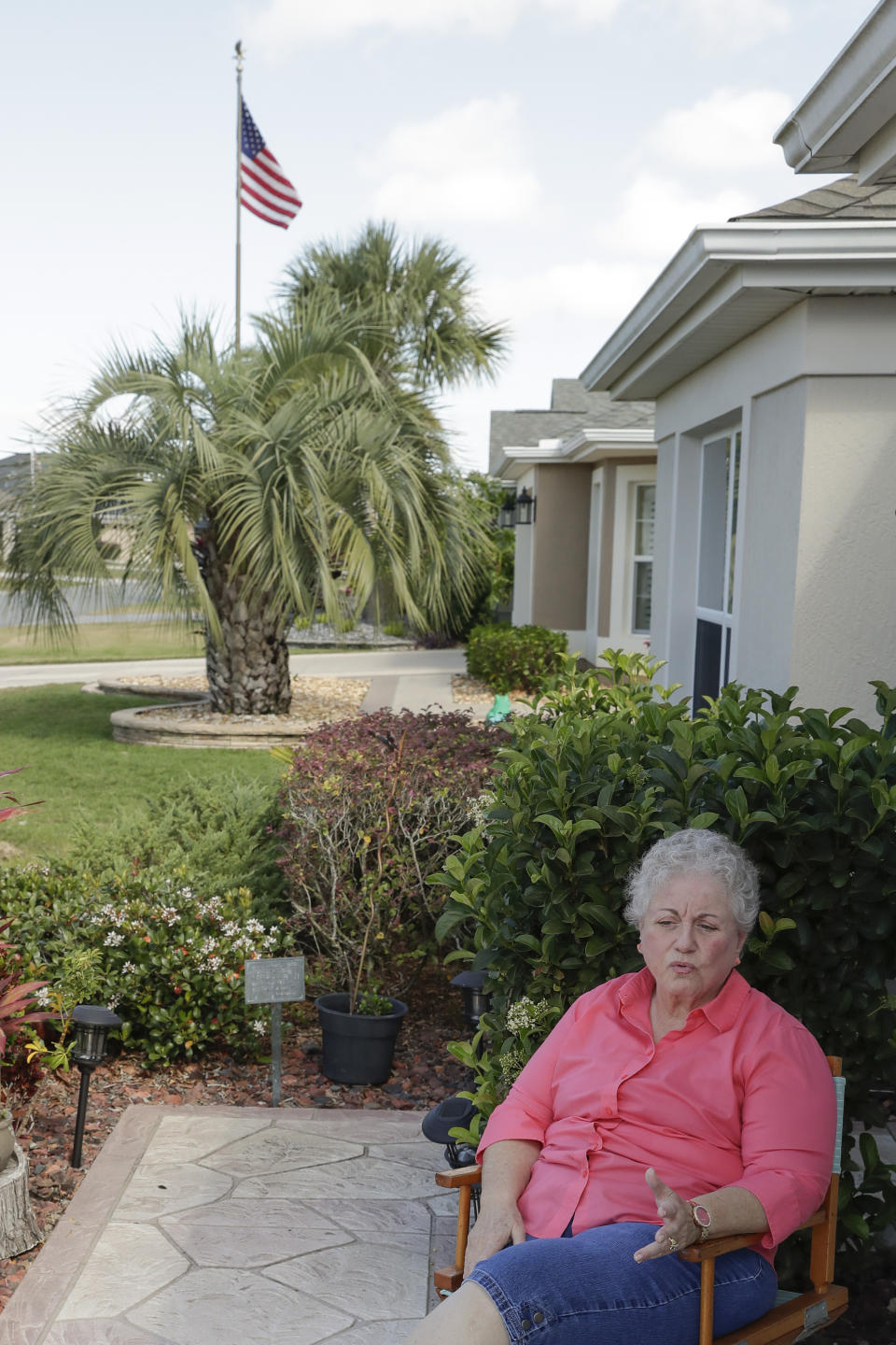 In this Thursday, March 19, 2020 photo, Shirley Schantz, at her home, discusses current issues living in a retirement community in The Villages, Fla. Due to the coronavirus all regularly-scheduled indoor activities were canceled through the end of the month for residents living in what is perhaps the largest concentration of seniors in the U.S. (AP Photo/John Raoux)