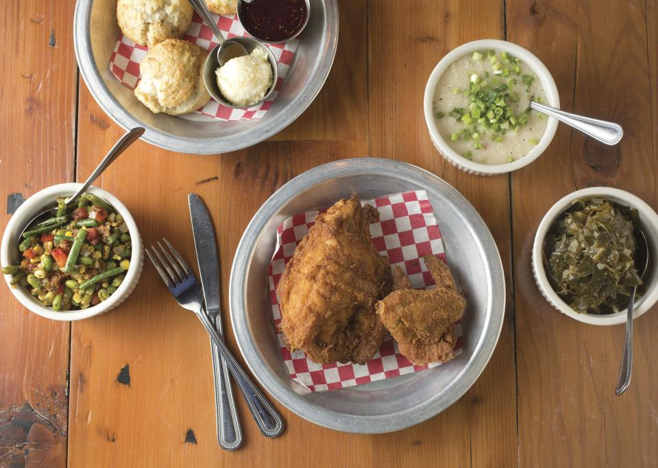 Fried chicken with sides of succotash, collard greens, biscuits and white cheddar grits from the Eagle in the Short North.