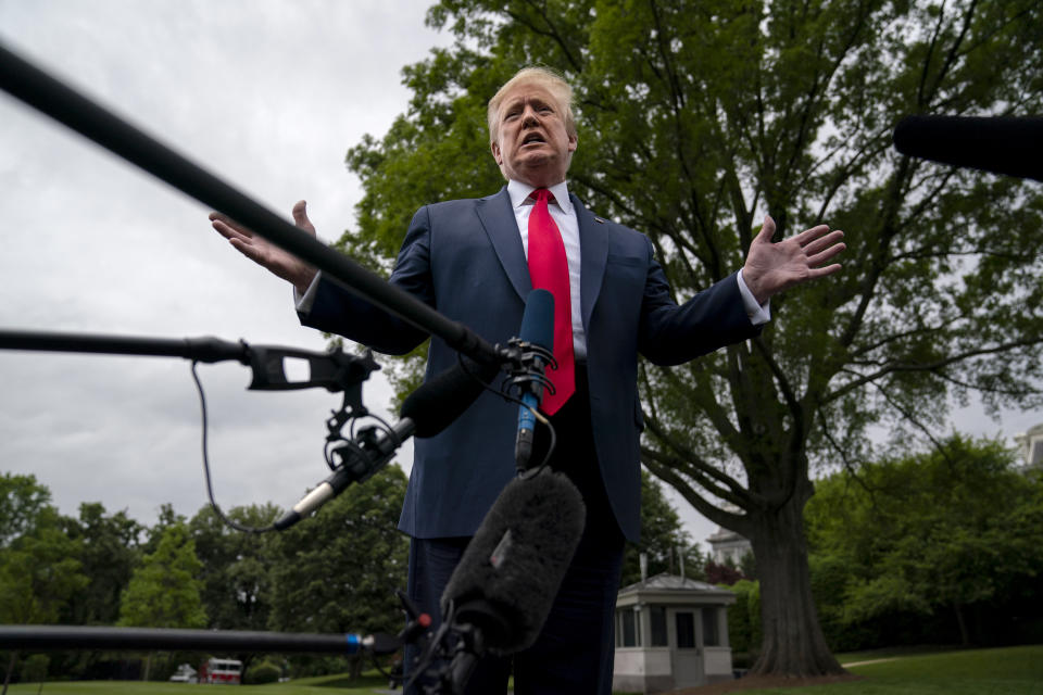 President Donald Trump talks to reporters before departing the White House for a trip to Michigan, Thursday, May 21, 2020, in Washington. (Evan Vucci/AP)