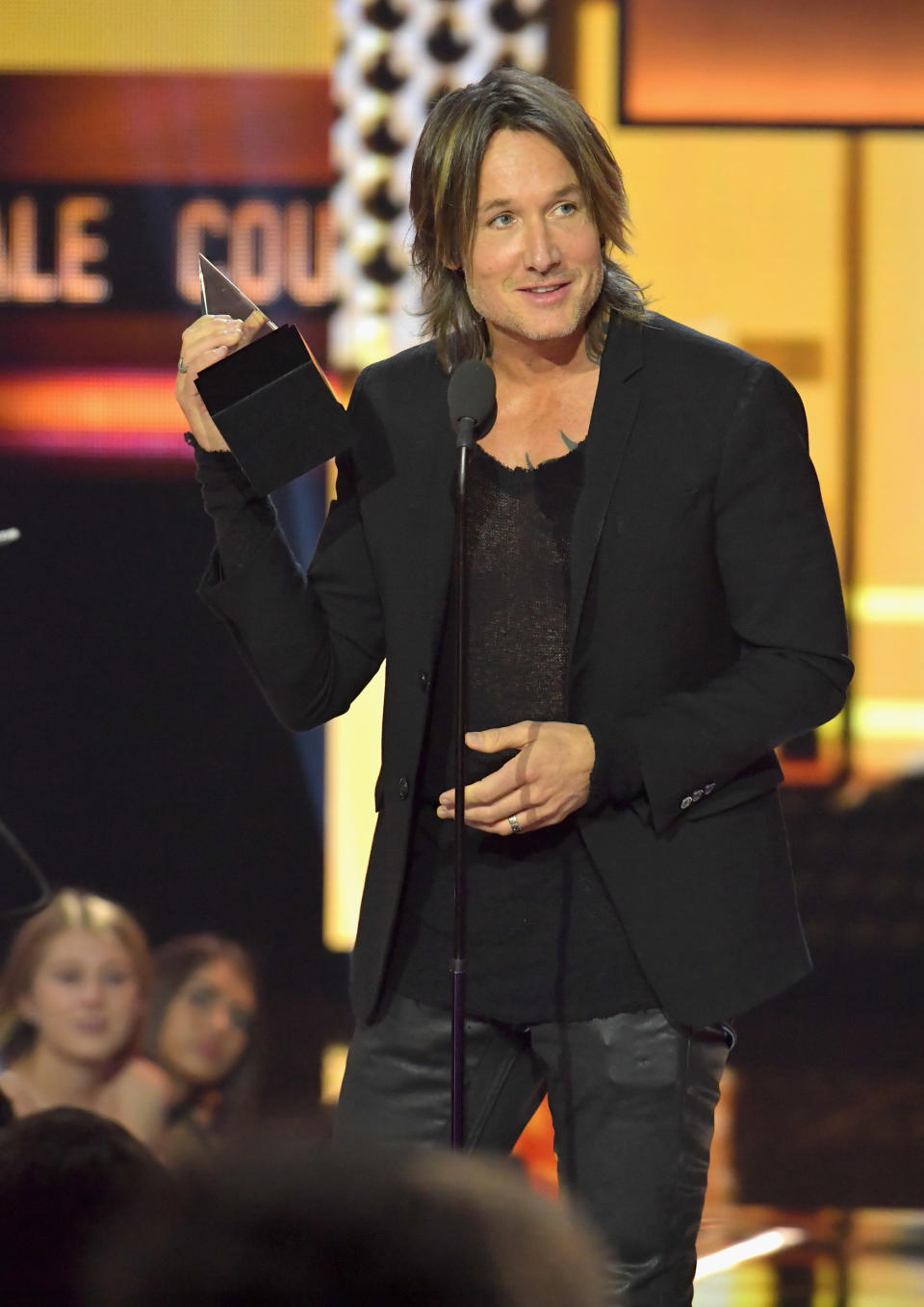 LOS ANGELES, CA - NOVEMBER 19:  Keith Urban accepts the Favorite Male Artist - Country, Favorite Album - Country and Favorite Song - Country awards onstage during the 2017 American Music Awards at Microsoft Theater on November 19, 2017 in Los Angeles, California.  (Photo by Lester Cohen/WireImage)