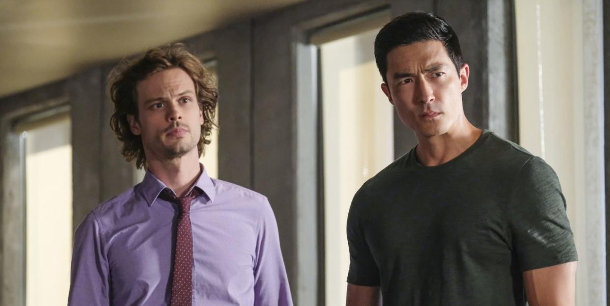 two characters from criminal minds stand next to each other