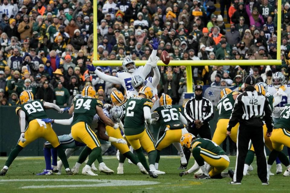 Green Bay Packers place kicker Mason Crosby (2) misses on a long field goal attempt during the first half of an NFL football game against the Dallas Cowboys on Sunday.