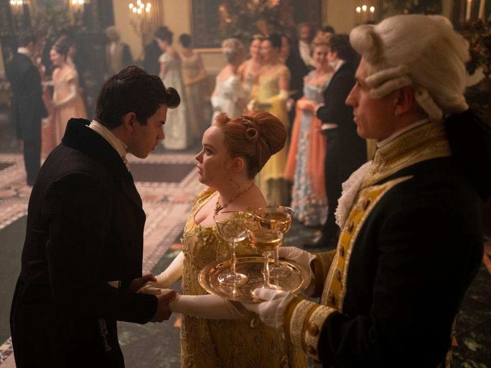 Colin Bridgerton talking to Penelope Featherington at a ball on "Bridgerton."