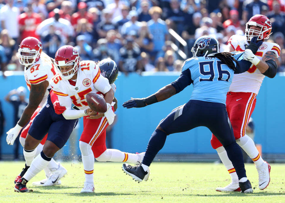 Bud Dupree of the Tennessee Titans forces a fumble by Patrick Mahomes. (Photo by Andy Lyons/Getty Images)