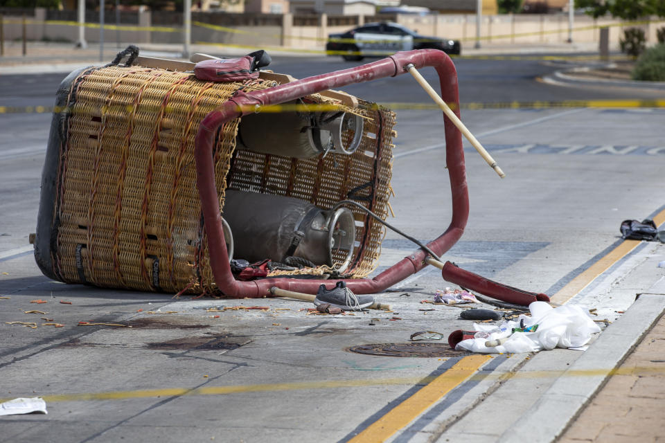 Debris scattered around the basket of a hot-air balloon on an Albuquerque street.