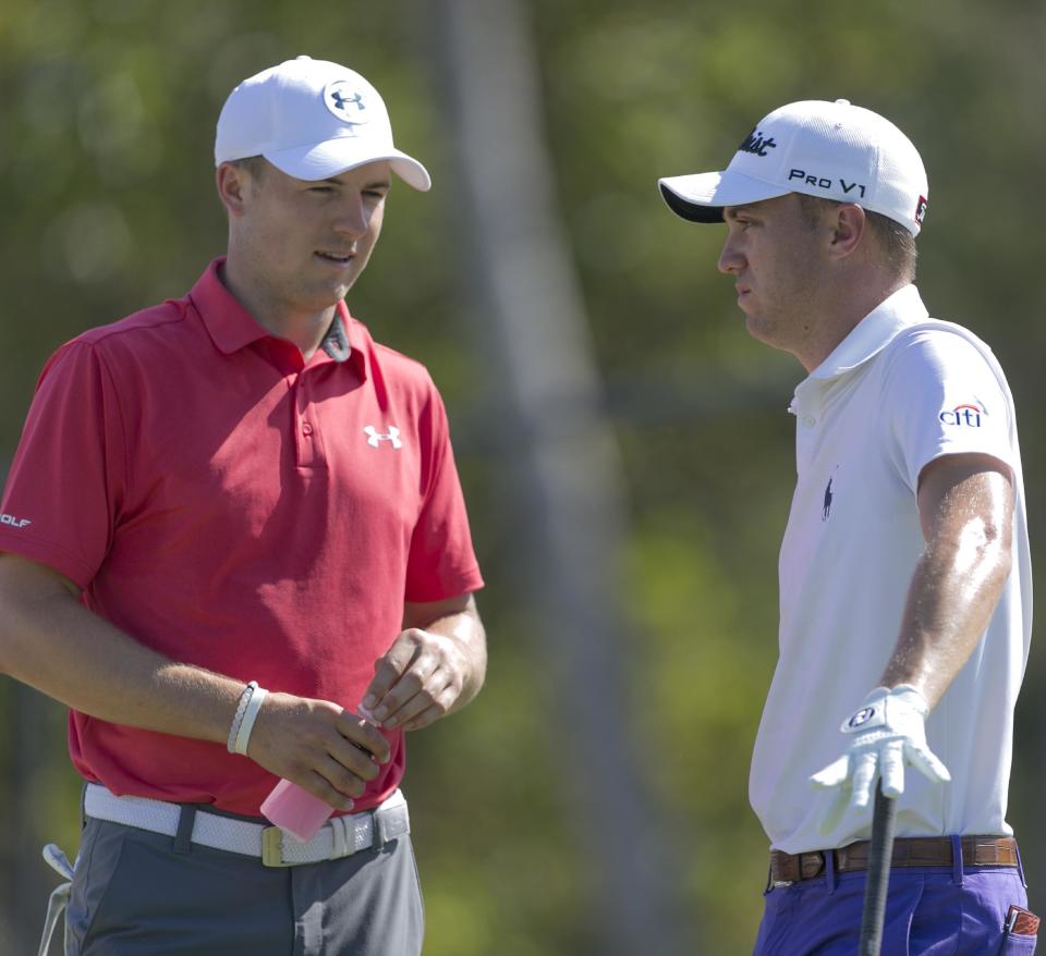 Jordan Spieth, left, and Justin Thomas chat before their second round at the Sony Open golf tournament, Friday, Jan. 13, 2017, in Honolulu. (AP Photo/Marco Garcia)