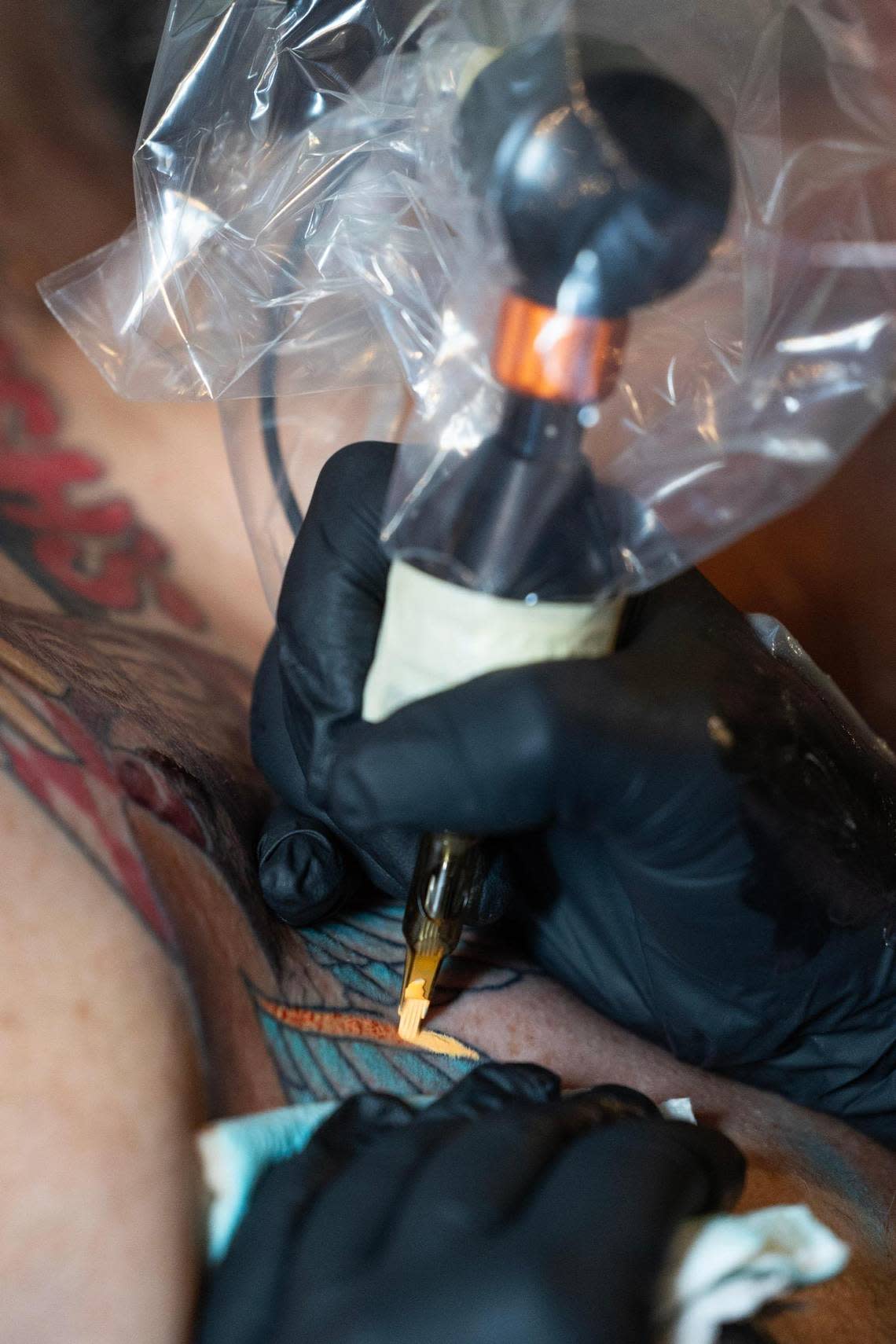 Nick Sielicki gets more color on a tattoo in honor of Columbia restaurant chain Rush’s at Southern Cypress Tattoo on Saturday, June 17, 2023. Joshua Boucher/jboucher@thestate.com