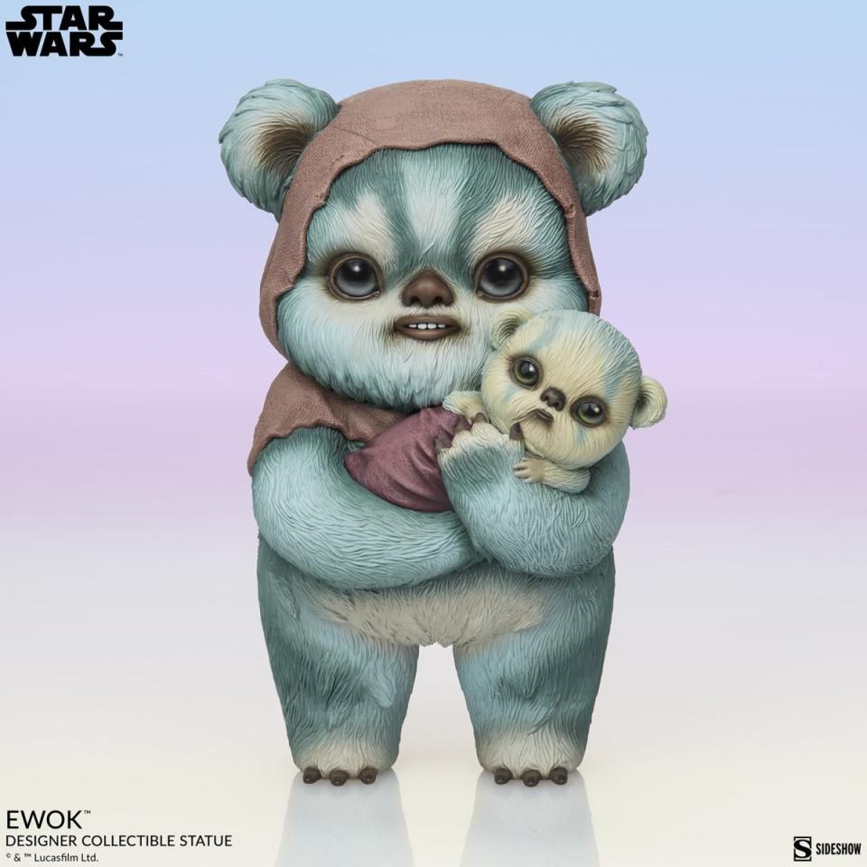 Front of Ewok holding a baby statue