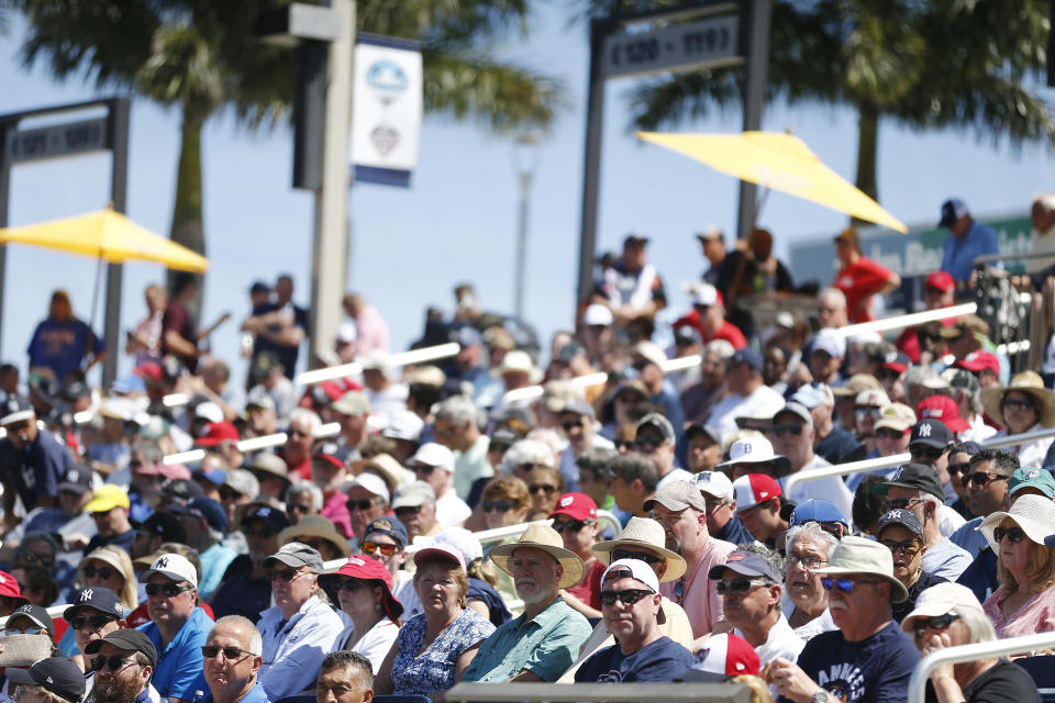 VARIOUS CITIES,  - MARCH 12:  Fans look on during the bottom of the fifth inning of a Grapefruit League spring training game between the Washington Nationals and the New York Yankees at FITTEAM Ballpark of The Palm Beaches on March 12, 2020 in West Palm Beach, Florida. Many professional and college sports, including the MLB, are canceling or postponing their games due to the ongoing threat of the Coronavirus (COVID-19) outbreak. (Photo by Michael Reaves/Getty Images)