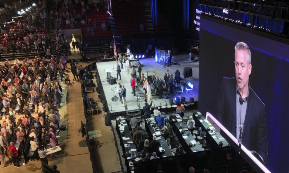 JD Greear, president of the Southern Baptist Convention, is seen on a video screen as he addresses a congregation in Birmingham, Alabama in 2019.