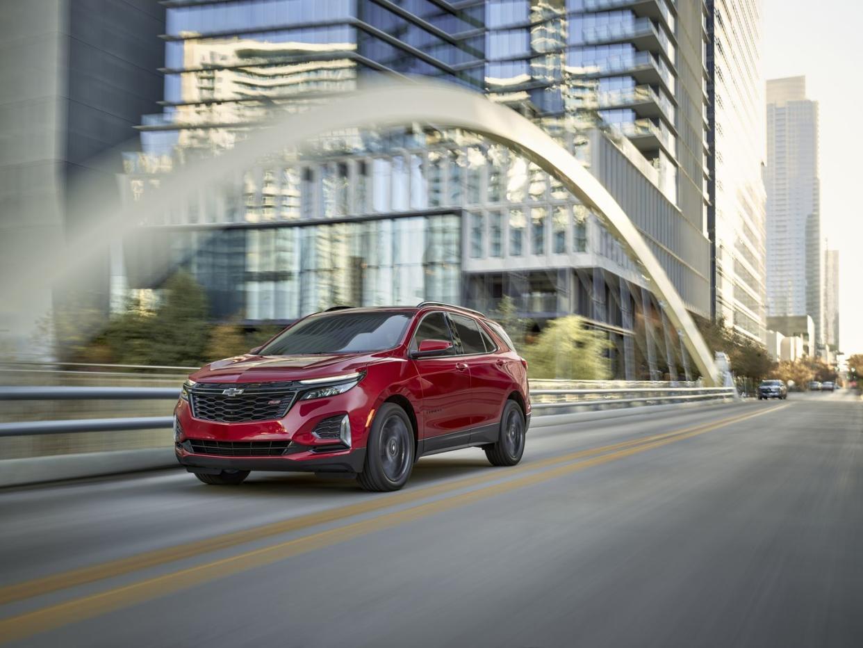 front 34 view of 2024 chevrolet equinox rs in radiant red tintcoat