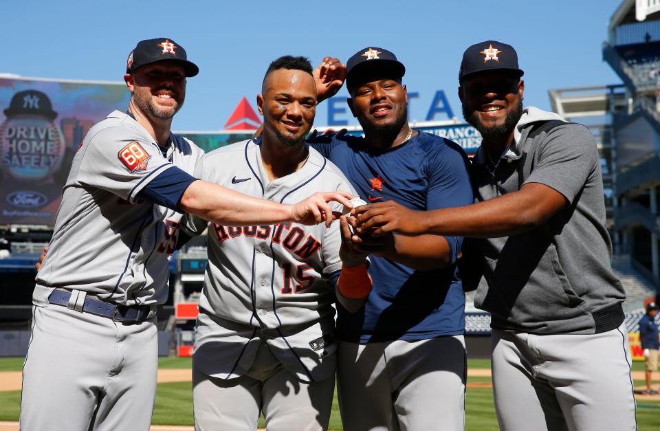 Houston Astros players, from left, relief pitcher Ryan Pressly, catcher Martin Maldonado, relief pitcher Hector Neris, and starting pitcher Cristian Javier celebrate after a combined no-hitter against the New York Yankees. Saturday, June 25, 2022, in New York. The Houston Astros won 3-0. (AP Photo/Noah K. Murray)