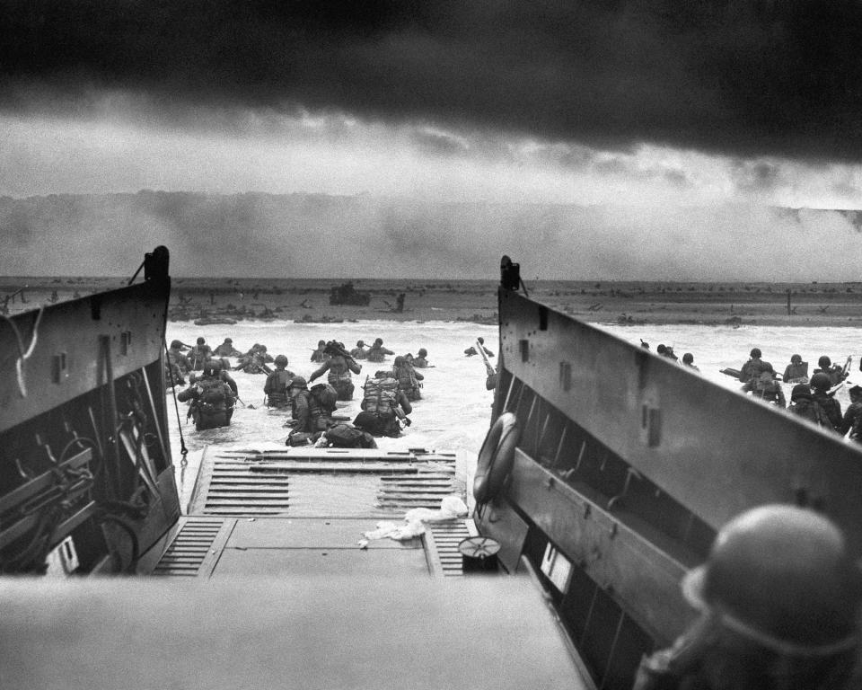 FILE - This photograph is believed to show E Company, 16th Regiment, 1st Infantry Division, participating in the first wave of assaults during D-Day in Normandy, France, June 6, 1944. The greatest armada ever assembled, nearly 7,000 ships and boats, supported by more than 11,000 planes, carried almost 133,000 troops across the Channel to establish toeholds on five heavily defended beaches stretched across 80 kilometers (50 miles) of Normandy coast. More than 9,000 Allied soldiers were killed or wounded in the first 24 hours. (Chief Photographer's Mate Robert M. Sargent, U.S. Coast Guard via AP, File)