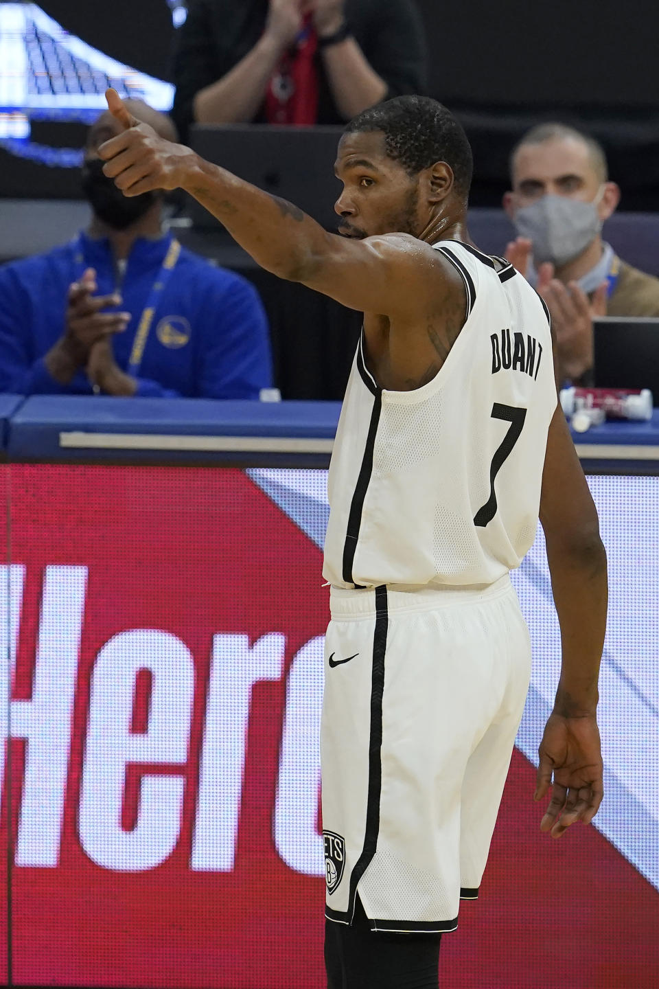 Brooklyn Nets forward Kevin Durant gestures after a video tribute to him was played during the first half of the Nets' NBA basketball game against the Golden State Warriors in San Francisco, Saturday, Feb. 13, 2021. (AP Photo/Jeff Chiu)