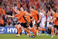 <p>Brisbane Roar celebrate a dramatic penalty-shootout win over Western Sydney Wanderers in the A League play-offs </p>