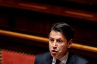 FILE PHOTO: Italian Prime Minister Giuseppe Conte addresses the upper house of parliament over the ongoing government crisis, in Rome