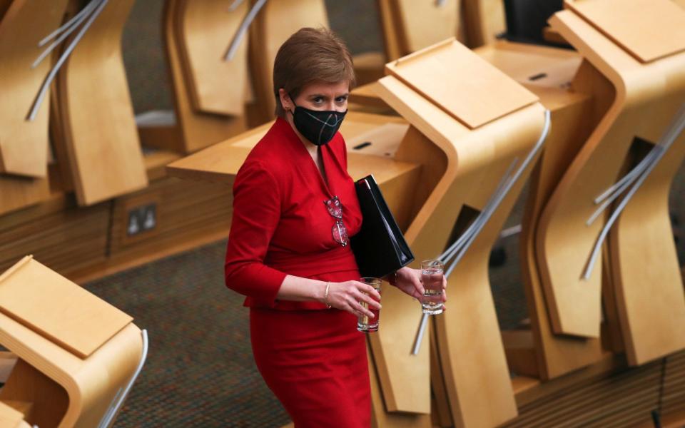  Scottish First Minister Nicola Sturgeon is seen at the Scottish Parliament to make a statement on the coronavirus restrictions - Russell Cheyne - Pool / Getty Images)