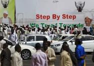 People gather outside the parliament before Sudan's President Omar Hassan al-Bashir takes an oath during his presidential inauguration ceremony for a new term at the National Assembly in Omdurman, June 2, 2015. REUTERS/Mohamed Nureldin Abdallah