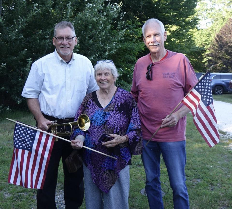 Trumpeter Paul Shoemaker, Meetinghouse Farm President Judy Desrochers and Lenny Clark of Barnstable Association for Recreational Shellfishing at the Flag Day event June 14 in West Barnstable.