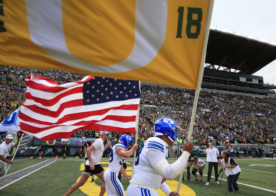 BYU brings a tribute to Spencer Webb onto the field at the start of the game against Oregon at Autzen Stadium Saturday, Sept. 17, 2022.