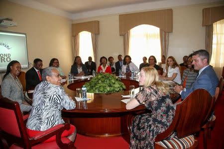 Singer-songwriter Madonna Ciccone (R) meets Kenyan First Lady Margaret Kenyatta (L) amongst other representatives at State House in Nairobi, Kenya, July 4, 2016. REUTERS/Presidential Press Service/Handout via REUTERS