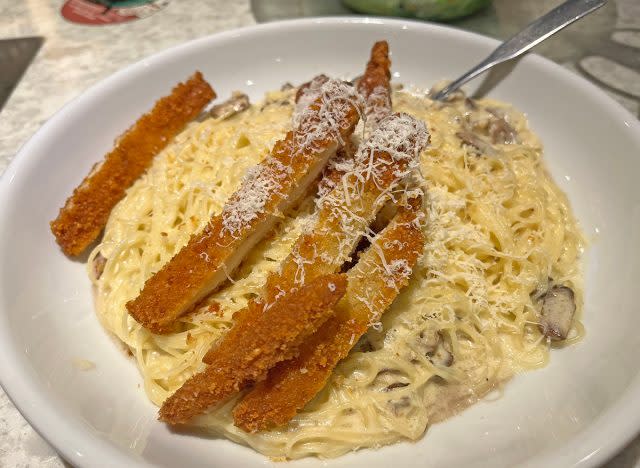 Angel hair pasta with creamy mushroom sauce and chicken fritta at Olive Garden