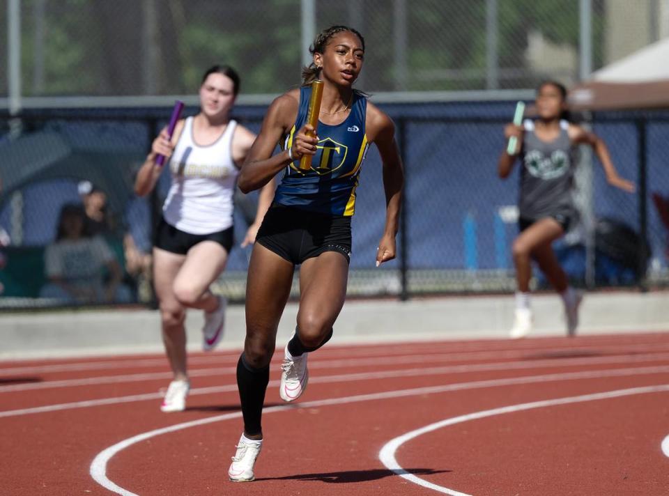 Turlock’s Olivia Walker runs the third leg of the 4x100 meter race during the Central California Athletic League Championships at Downey High School in Modesto, Calif., Wednesday, May 1, 2024. Turlock won the race with a time of 48.23.