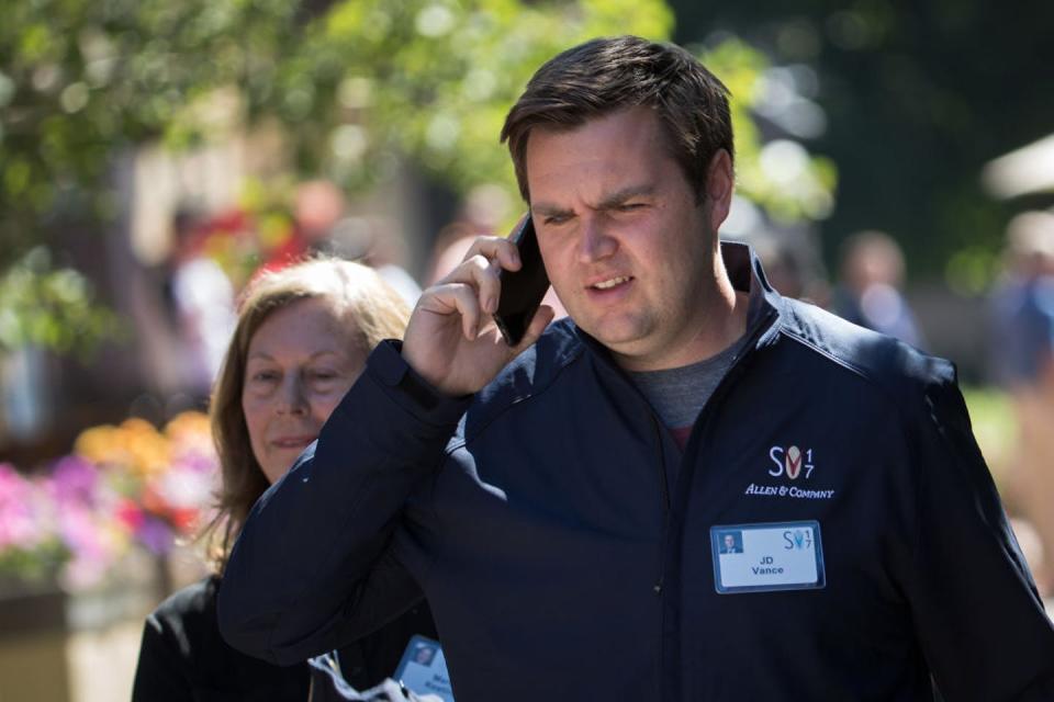 J.D. Vance talks on a cell phone.