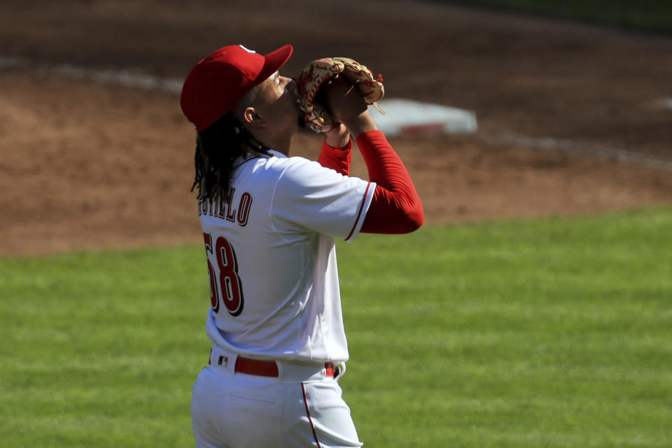Cincinnati Reds' Luis Castillo (58) reacts as he walks off the mound in the third inning during a baseball game against the Detroit Tigers at Great American Ballpark in Cincinnati, Saturday, July 25, 2020. (AP Photo/Aaron Doster)