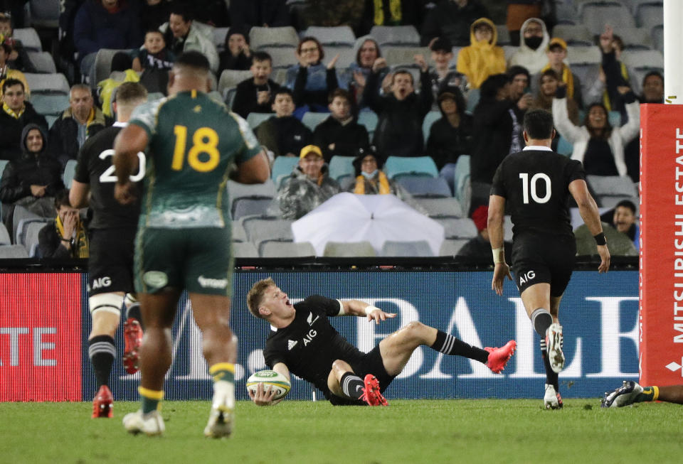 New Zealand's Jordie Barrett celebrates after scoring a try during the Bledisloe rugby test between the All Blacks and the Wallabies at Stadium Australia, Sydney, Australia, Saturday, Oct. 31, 2020. (AP Photo/Rick Rycroft)