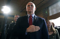 Former Vice President Mike Pence stands for the Pledge of Allegiance during a gathering, Wednesday, Dec. 8, 2021, in Manchester, N.H. (AP Photo/Charles Krupa)