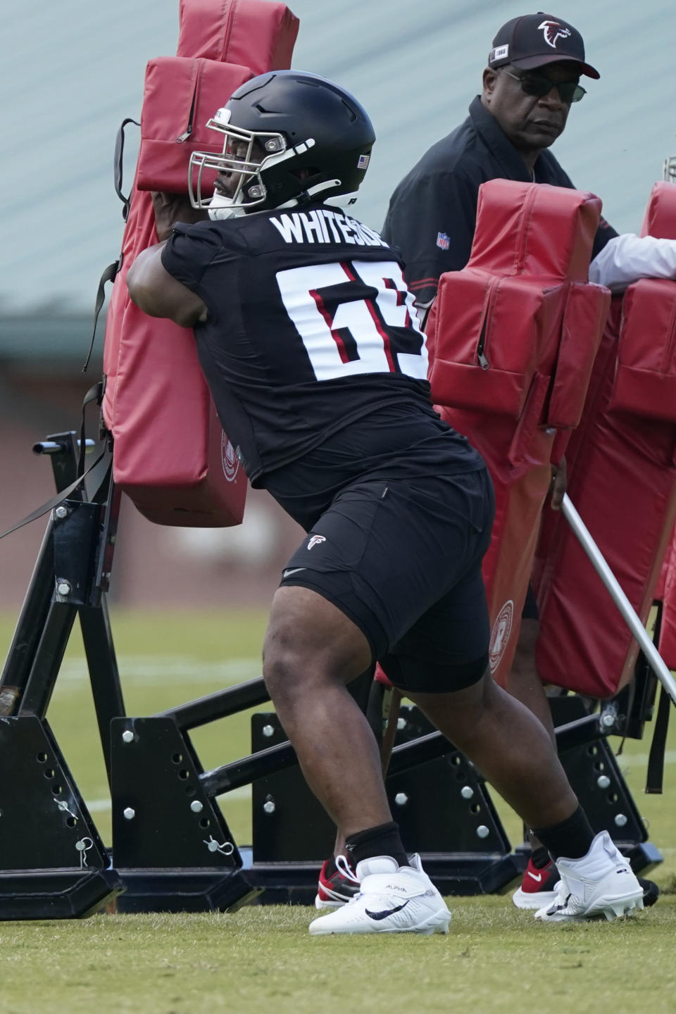 Atlanta Falcons defensive lineman Kobie Whiteside (69) works during the NFL football team's rookie minicamp, Saturday, May 14, 2022, in Flowery Branch, Ga. (AP Photo/John Bazemore)