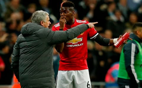 Manchester United's Portuguese manager Jose Mourinho (L) talks with Manchester United's French midfielder Paul Pogba (R) after the second Tottenham goal goes in during the English Premier League football match between Tottenham Hotspur and Manchester United at Wembley Stadium in London, on January 31, 2018 - Credit: AFP