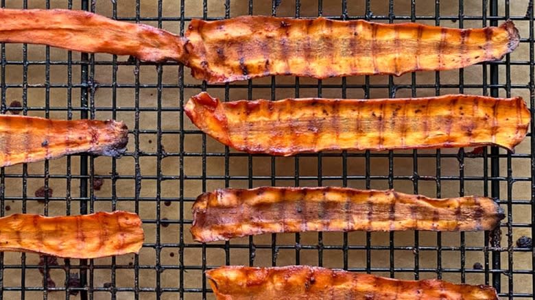 Strips of carrot bacon on cooling rack