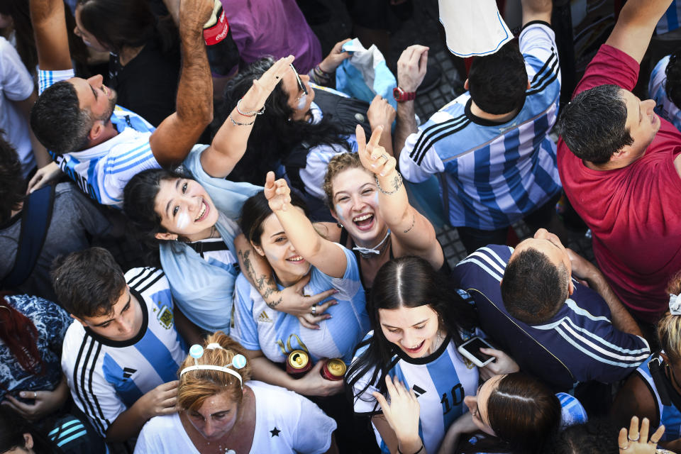 BUENOS AIRES, ARGENTINA - DECEMBER 18: Fans of Argentina celebrate after Argentina's victory against France in the final match of FIFA World Cup Qatar 2022 between Argentina and France on December 18, 2022 at Villa Urquiza neighborhood in Buenos Aires, Argentina. Argentina became World Champions of the FIFA World Cup Qatar 2022 after defeating France 4-3 on penalties. (Photo by Rodrigo Valle/Getty Images)