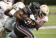 South Carolina running back Kevin Harris (20) carries against Tennessee's Kenneth George Jr. (5) and Devon Dillehay (23) during the first half of an NCAA college football game Saturday, Sept. 26, 2020, in Columbia, S.C. (AP Photo/Sean Rayford)