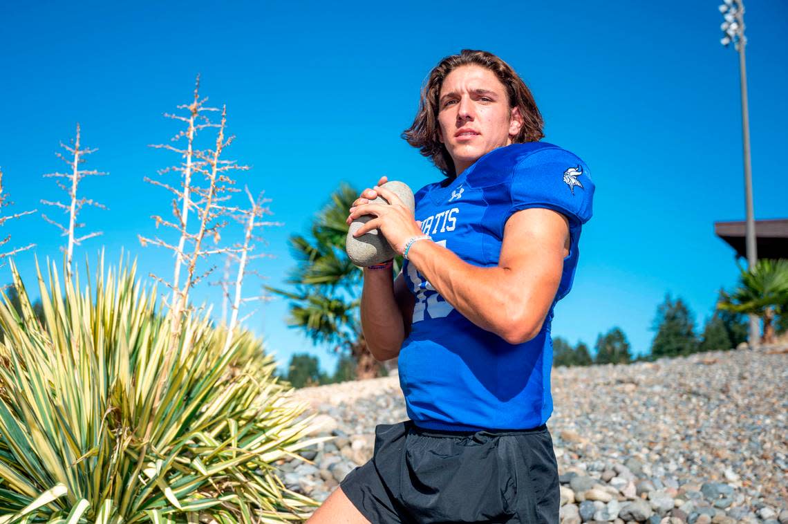 Curtis quarterback Rocco Koch poses for a portrait outside the stadium at Curtis High School on Wednesday, Sept. 7, 2022, in University Place, Wash.