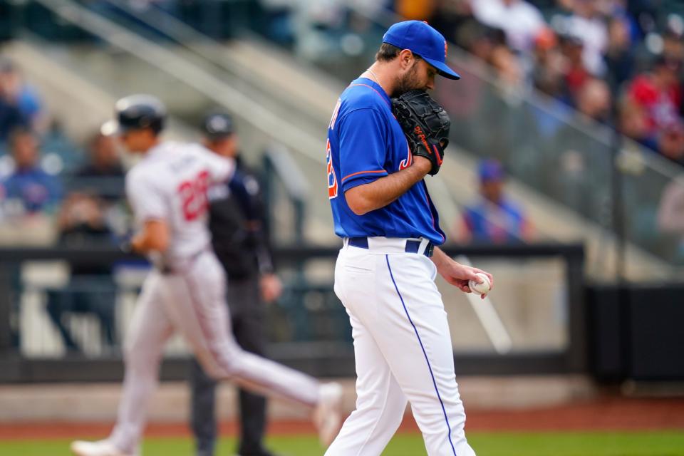 'New York Mets' pitcher David Peterson reacts as Atlanta Braves' Matt Olson runs the bases after hitting a three-run home run during the fifth inning in the first baseball game of a doubleheader Tuesday, May 3, 2022, in New York.