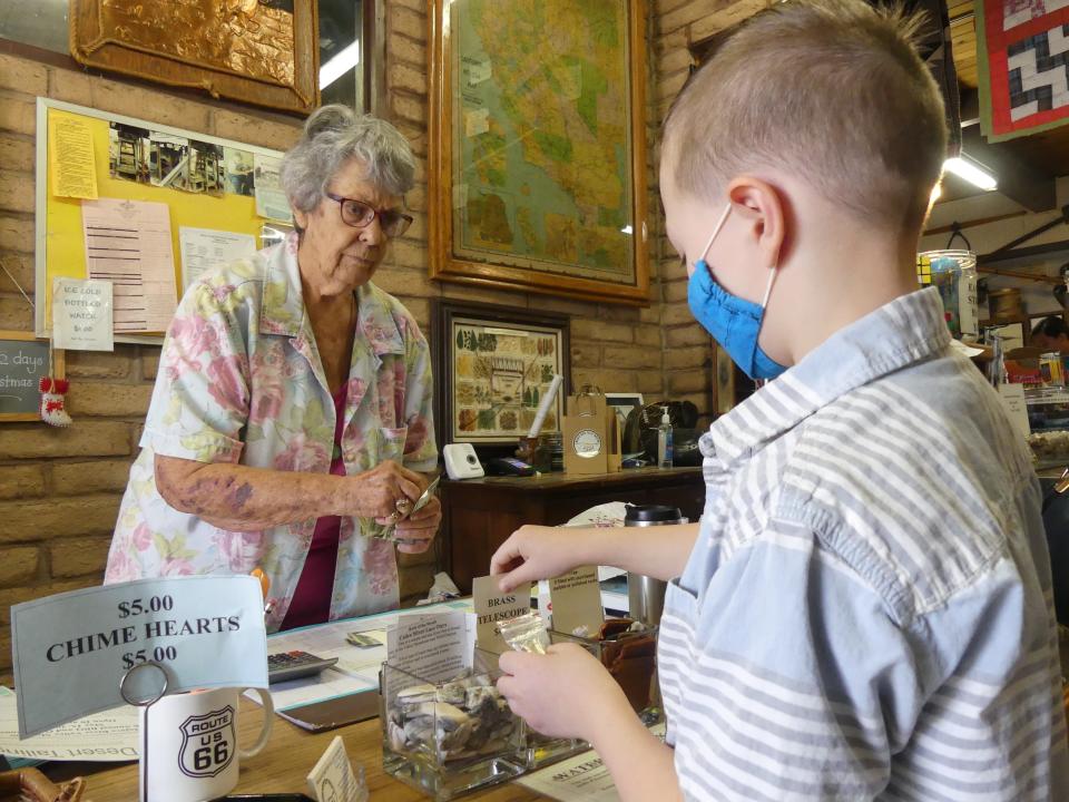 In this file photo, Mojave River Valley Museum Committee Chairwoman and docent Pat Schoffstall helps a young historian during the museum’s annual Barbecue and Open House. This year's event is on Saturday, May 14 in Barstow.