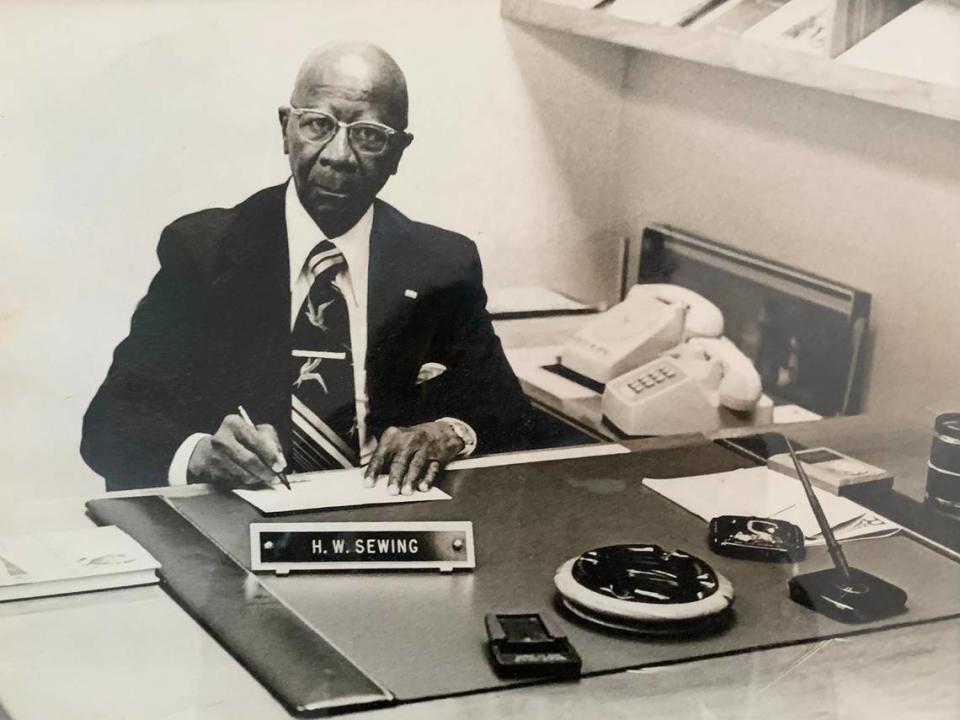 H.W. Sewing at his office in the Douglass State Bank in Kansas City, Kansas.