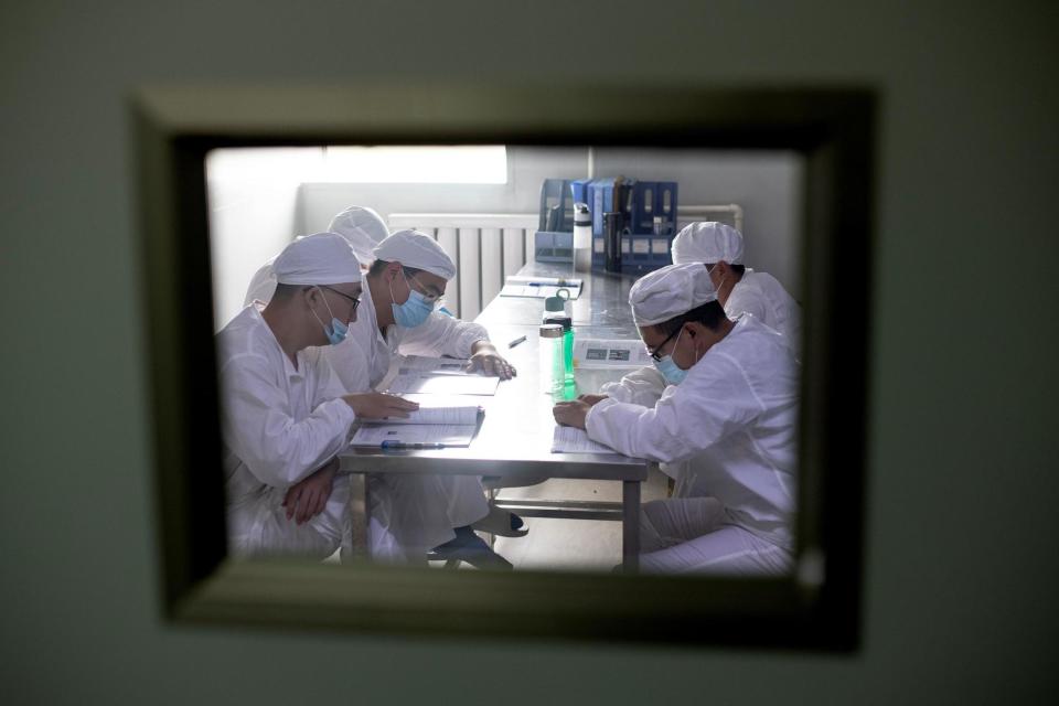 Chinese staff working on a vaccine (Getty Images)