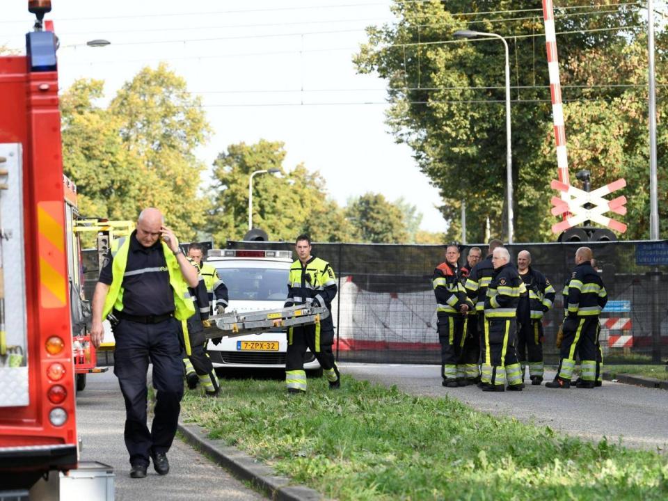 Rescue personnel work at the scene of the accident in the city of Oss, Netherlands (REUTERS/Piroschka van de Wouw)