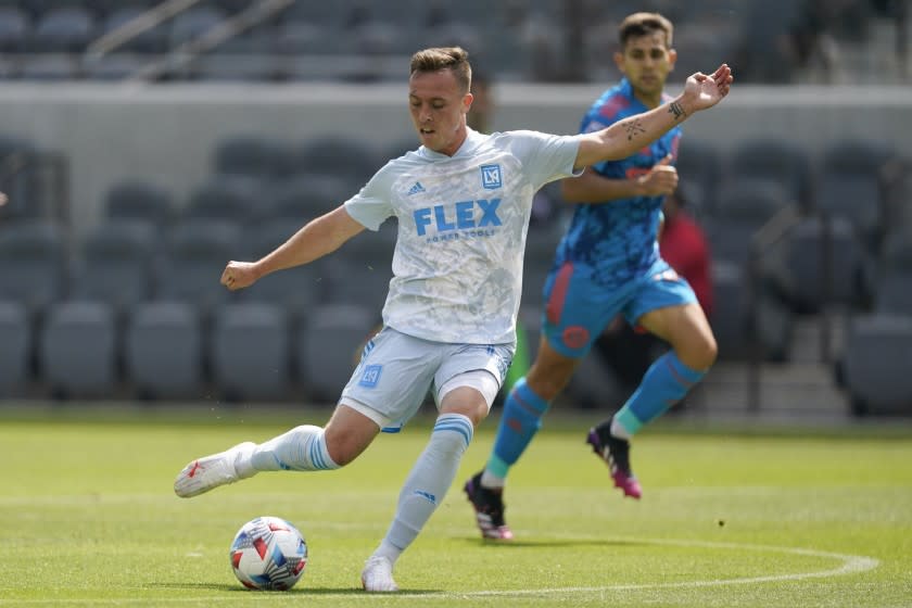 Los Angeles FC forward Corey Baird (13) shoot the ball during the second half of an MLS soccer game against the New York City FC Saturday, May 29, 2021, in Los Angeles. (AP Photo/Ashley Landis)