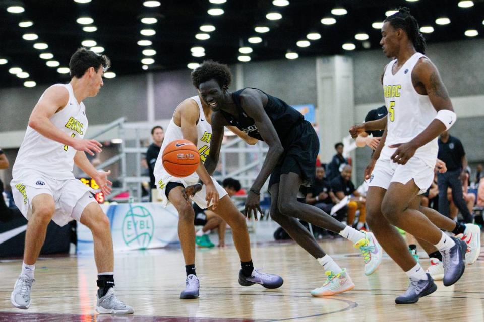 MoKan Elite’s John Bol (11) loses possession of the ball during a Nike EYBL session in Louisville. The 7-foot-2 Bol is in only his third season of organized basketball but is already attracting major college attention.